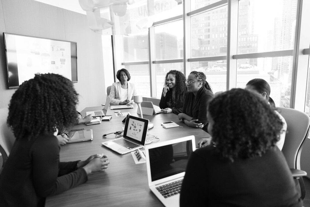 mentor guiding business professionals
